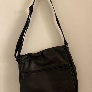 Tumi Black Messenger Bag with Adjustable Strap and Multiple Compartments